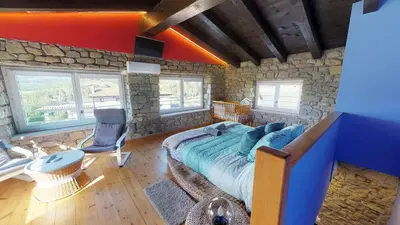 Zona de estar de Casa Rural La Abadia-Apartamentos