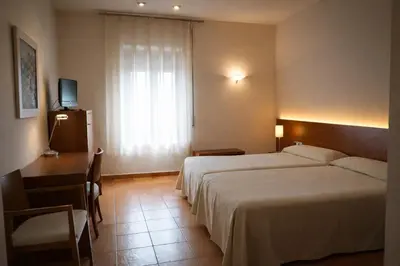 Cama o camas de una habitación en Hotel Santuari Balaguer