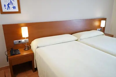 Cama o camas de una habitación en Hotel Santuari Balaguer
