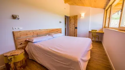 Cama o camas de una habitación en Casa Rural Cal Rossa de Taus SPA