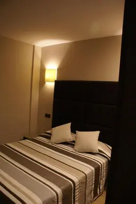 Cama o camas de una habitación en Apartamentos Casa Roldan