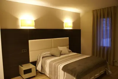Cama o camas de una habitación en Apartamentos Casa Roldan