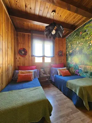 Cama o camas de una habitación en El Jardin de Gala
