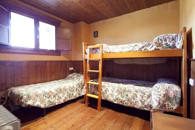Cama o camas de una habitación en Baqueira 1700 pie de pistas Tanau 4 hab