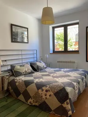 Cama o camas de una habitación en Apartamentos Bonaigua TG