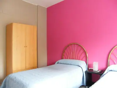 Cama o camas de una habitación en Pensión Corona