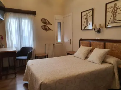 Cama o camas de una habitación en Hostal Canigó