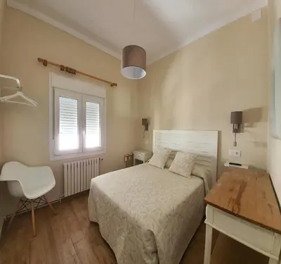 Cama o camas de una habitación en Hostal Canigó