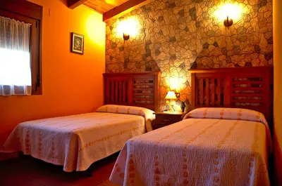 Cama o camas de una habitación en casa oliva la bodegueta
