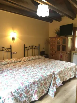 Cama o camas de una habitación en Casa Rural Era de Ferro