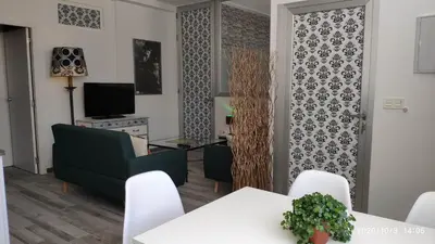 Una televisión o centro de entretenimiento en Apartamento La Luna
