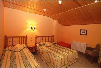 Cama o camas de una habitación en Hotel Restaurante Revestido