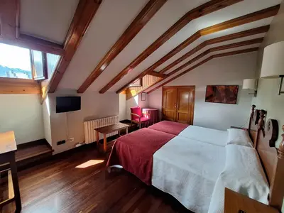 Cama o camas de una habitación en Hotel Aragüells