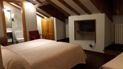 Cama o camas de una habitación en Hotel Aragüells