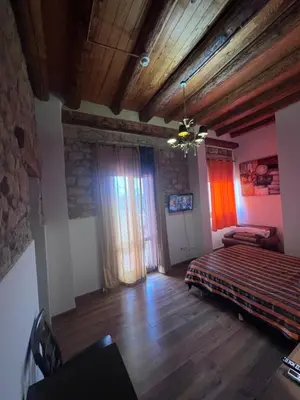 Cama o camas de una habitación en La Garbinada Hotel