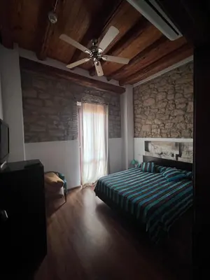 Cama o camas de una habitación en La Garbinada Hotel