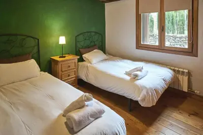 Cama o camas de una habitación en Casapirineos (Apartamentos)