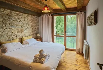 Cama o camas de una habitación en Casapirineos (Apartamentos)