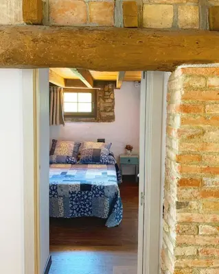 Cama o camas de una habitación en El celler de Cal Garriga