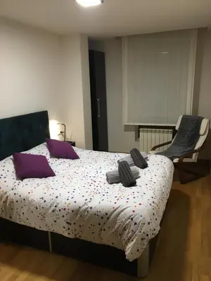 Cama o camas de una habitación en SkyLinePamplona