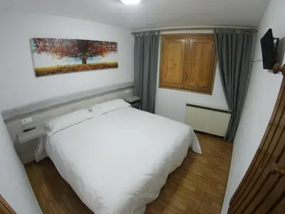 Cama o camas de una habitación en Hostal Casa Palmira