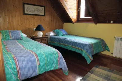 Cama o camas de una habitación en Bagergue casa aranesa