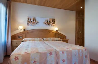 Cama o camas de una habitación en Hostal Pey
