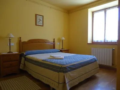 Cama o camas de una habitación en Apartaments La Llucana