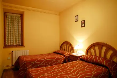 Cama o camas de una habitación en Apartaments La Llucana