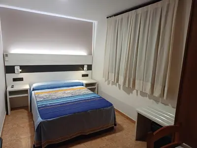 Cama o camas de una habitación en Hostal Restaurante El Castillo