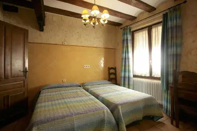 Cama o camas de una habitación en Hotel Rural Bidean