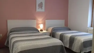 Cama o camas de una habitación en Vivienda Lanzón