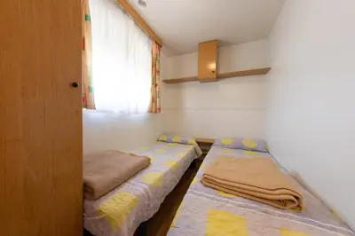 Cama o camas de una habitación en Bungalowpark Isábena