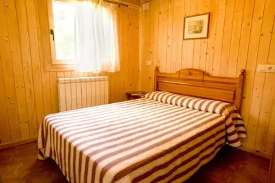 Cama o camas de una habitación en Bungalows La Borda d´Arnaldet