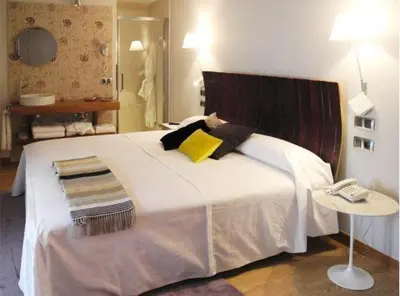 Cama o camas de una habitación en Hospederia Chapitel