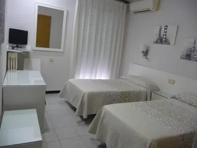 Cama o camas de una habitación en Hotel Goya