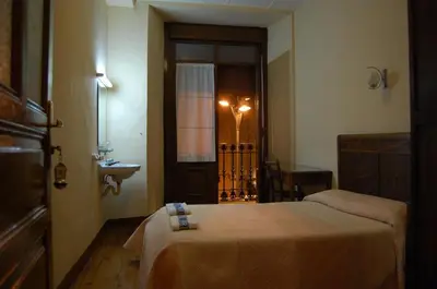Cama o camas de una habitación en Hostal Paris
