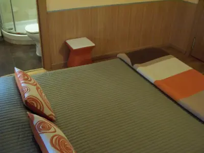 Cama o camas de una habitación en Hostal El Carmen