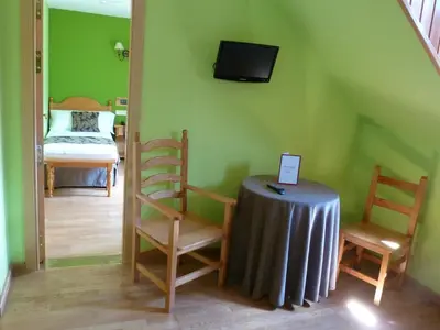 Una televisión o centro de entretenimiento en Hotel Sabocos