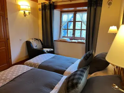Cama o camas de una habitación en Casa de piedra con encanto en el bonito pueblo de Bagergue