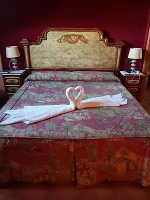 Cama o camas de una habitación en Hotel Posada Real