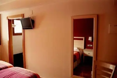 Cama o camas de una habitación en Hostal Rural Haizea