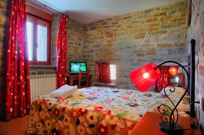 Cama o camas de una habitación en Casas Pirineo, Ainsa