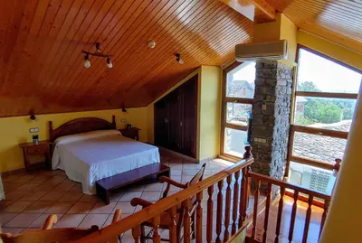 Cama o camas de una habitación en Hotel Rural LAbadia de Sieste