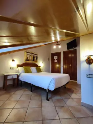 Cama o camas de una habitación en Hotel Rural LAbadia de Sieste