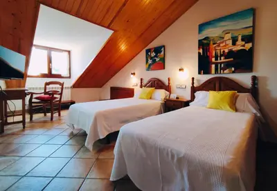 Cama o camas de una habitación en Hotel Rural LAbadia de Sieste