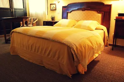 Cama o camas de una habitación en Hotel La Posada de Lalola