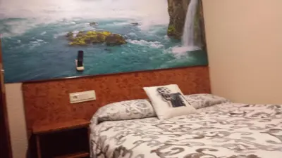 Cama o camas de una habitación en Hostal Venecia