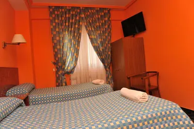 Cama o camas de una habitación en Hostal Venecia