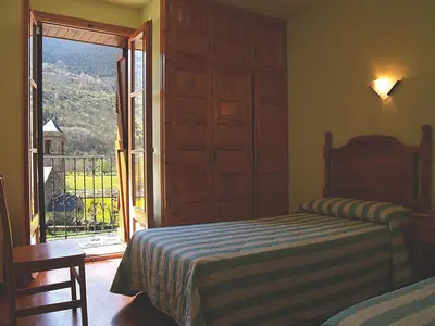 Cama o camas de una habitación en Casa Rural Hortal